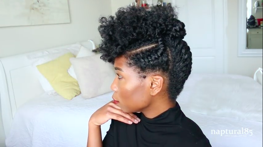 curls have been cut to create a mohawk shape down this haircut isn't s...