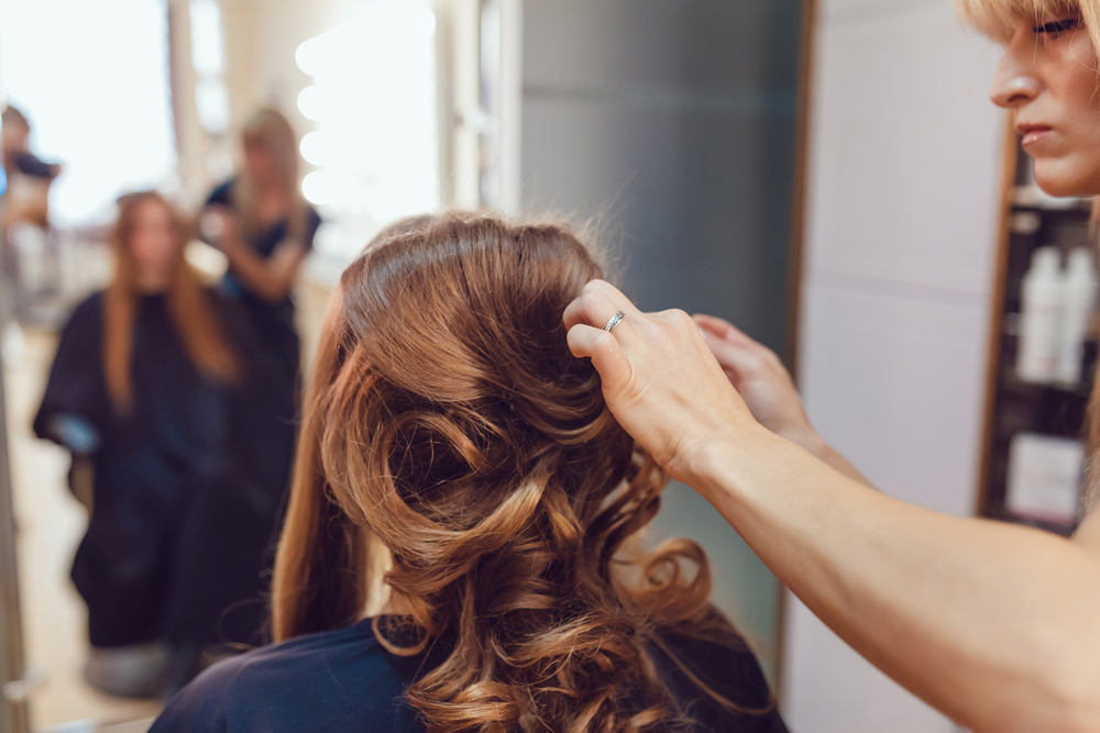 hair stylist doing a bridal look