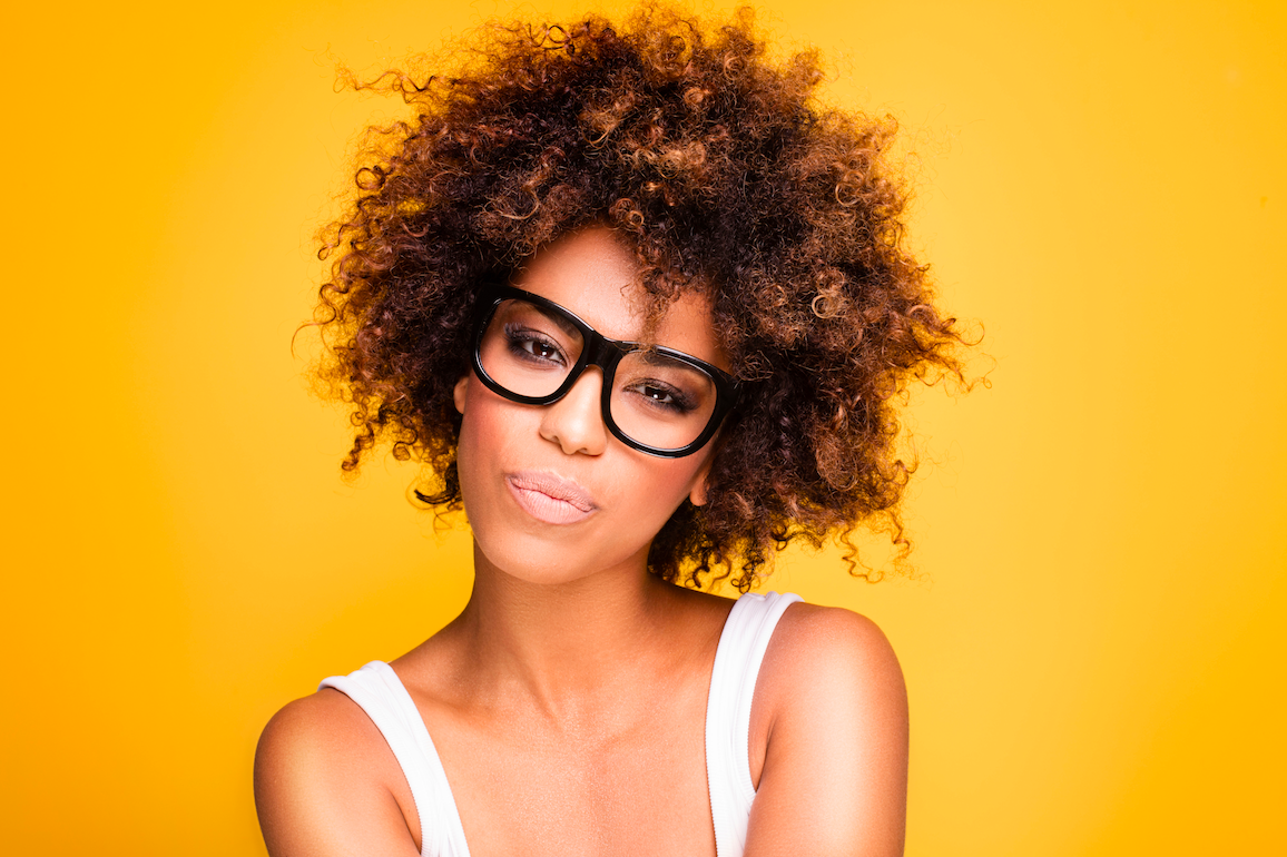 African American woman with glasses and crazy kinky hair