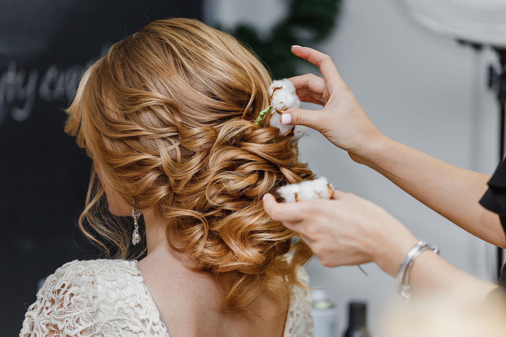 stylist doing bride's hair