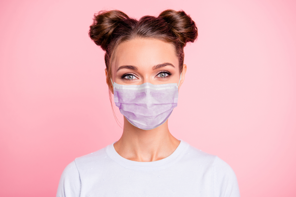 woman wearing face mask and eye makeup